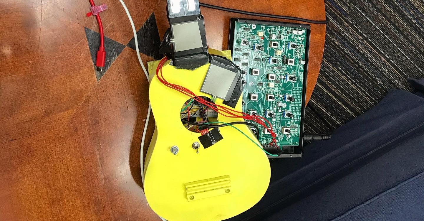 Ukelele with electronics attached